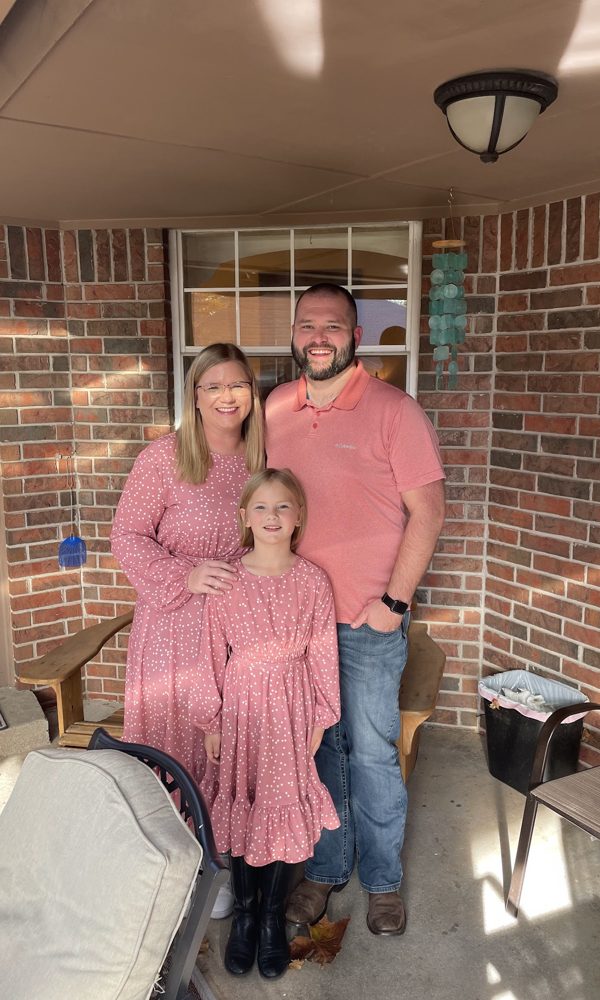 Tara, Tyler and Ivy in matching pink on the porch