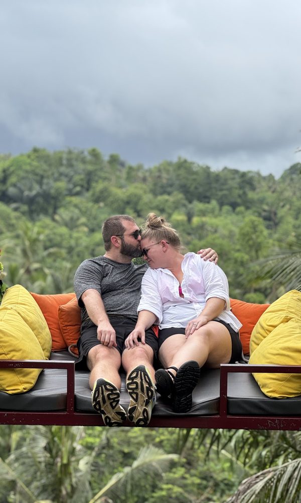 Tara and Tyler on a swing above the jungle